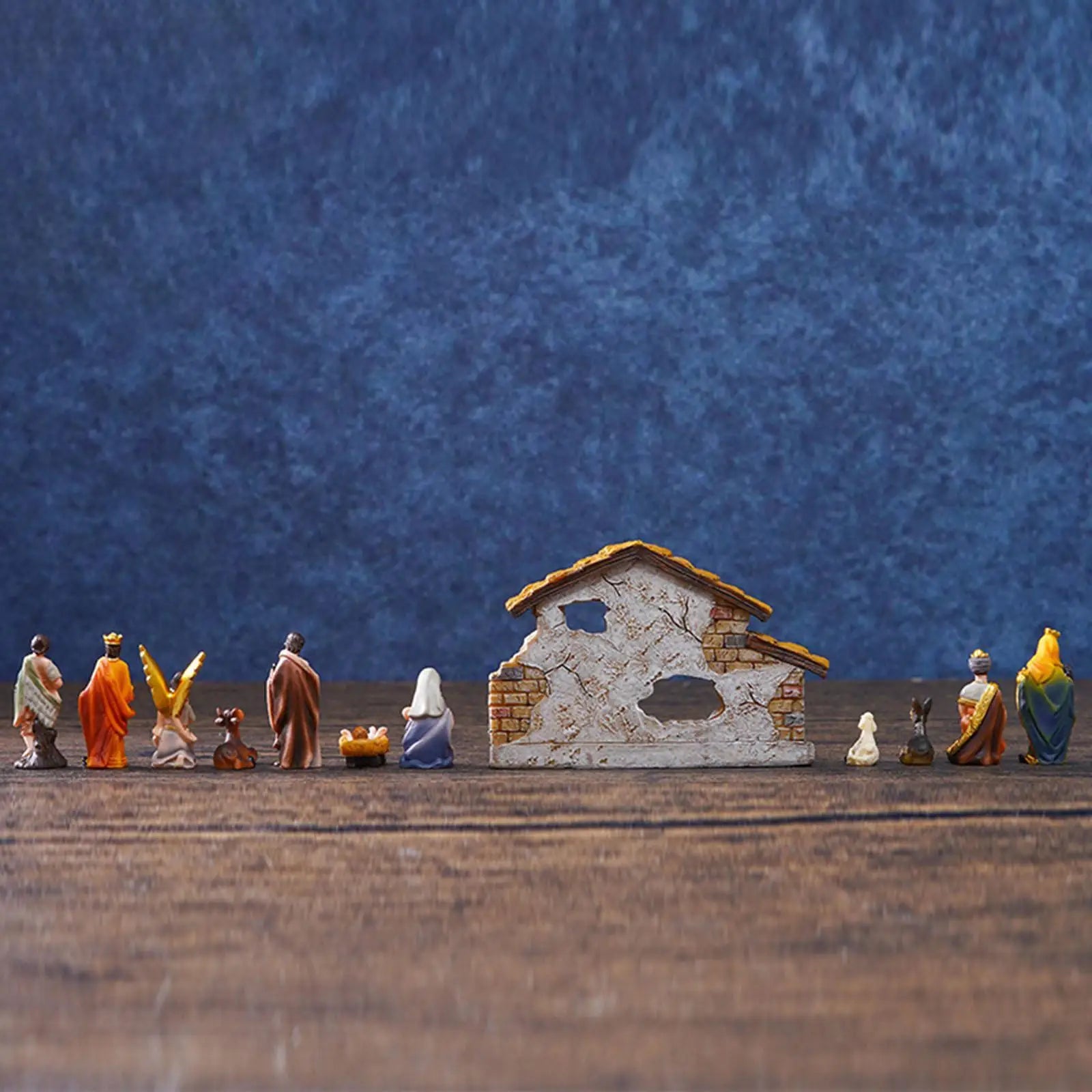 Handmade Christmas Nativity Scene Set featuring Holy Family statues and figurines.