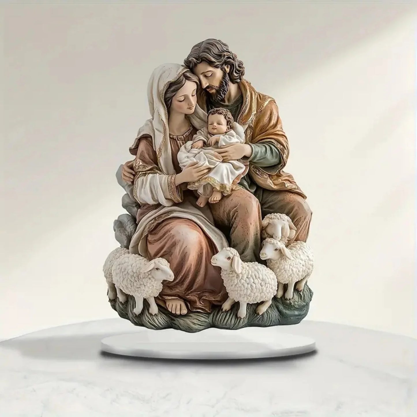 Statue of a family with a baby, surrounded by sheep on a white background